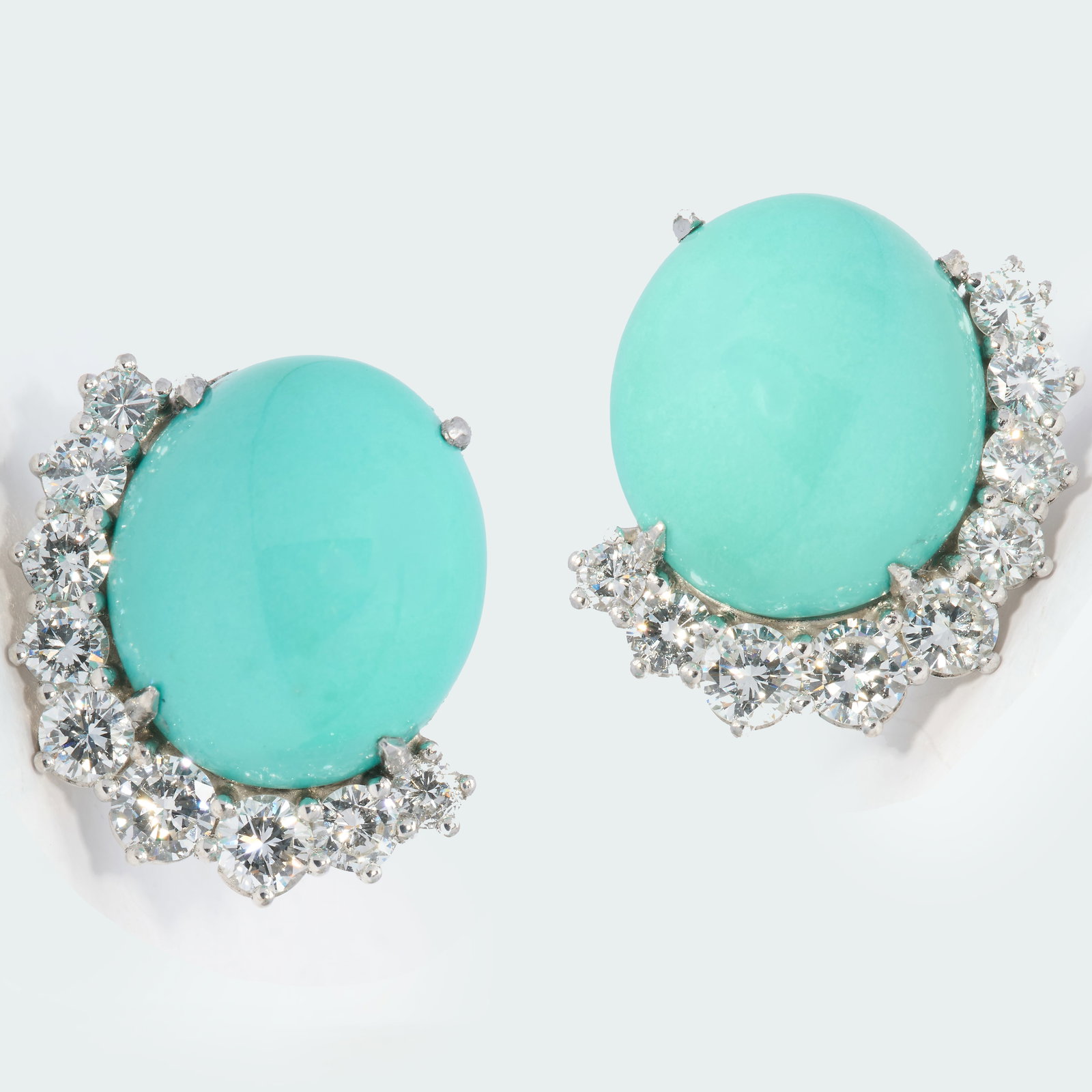 PAIR OF TURQUOISE AND DIAMOND EARRINGS: PAIR OF TURQUOISE AND DIAMOND EARRINGS,9.3 grams, testing 18 ct. gold.Rich and vibrant turquoise.Bright and lively diamonds.L 1.7 cm.