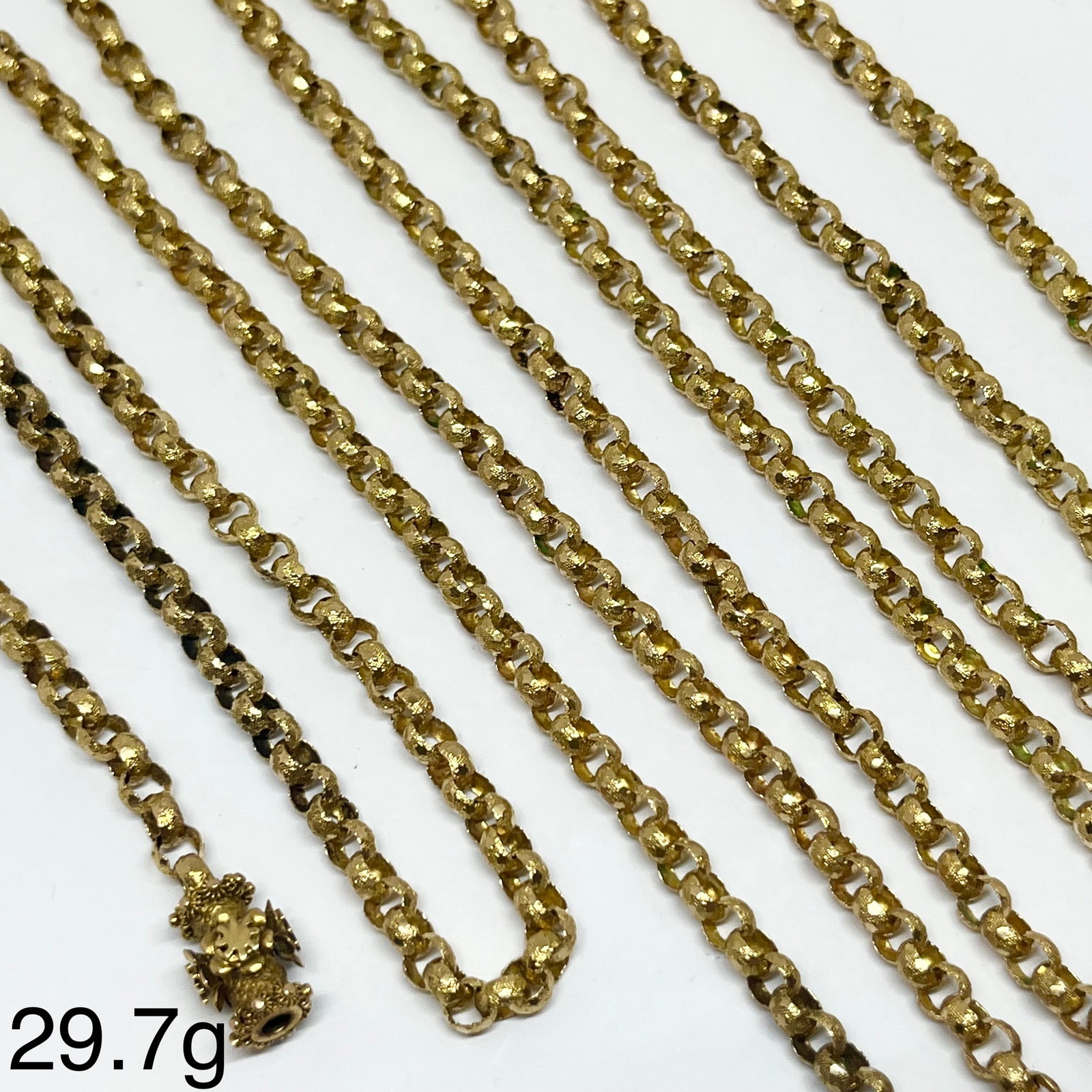 LOVELY ANTIQUE FANCY LINK GUARD CHAIN: LOVELY ANTIQUE FANCY LINK GUARD CHAIN.29.7 grams, testing high carat gold.The links each with lovely star and relief decoration.L. 123 cm.