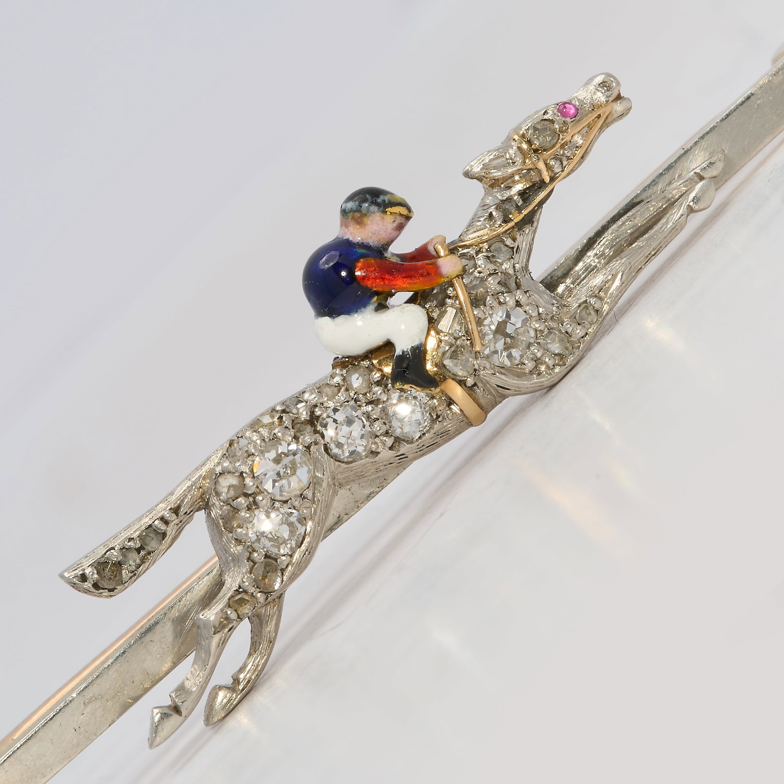 ANTIQUE DIAMOND AND ENAMEL JOCKEY BROOCH: ANTIQUE DIAMOND AND ENAMEL JOCKEY BROOCH 5.7 grams enamel in great condition bright lively diamonds W 4.4 cm