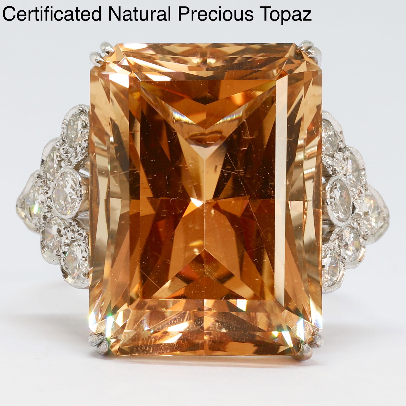 CERTIFICATED NATURAL PRECIOUS TOPAZ AND DIAMOND RING: CERTIFICATED NATURAL PRECIOUS TOPAZ AND DIAMOND RING 11.8 grams platinum and high carat gold rich vibrant natural topaz with no abrasions approx. 31.62 ct bright lively diamonds size N