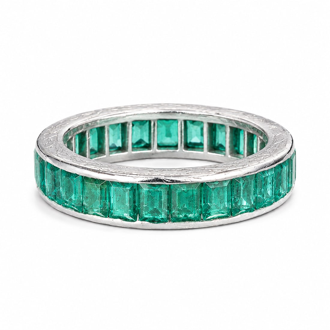 EMERALD ETERNITY RING: EMERALD ETERNITY RING6.2 grams, stamped PLAT.Vibrant emeralds, totalling approx. 3ct.Size M 1/2.