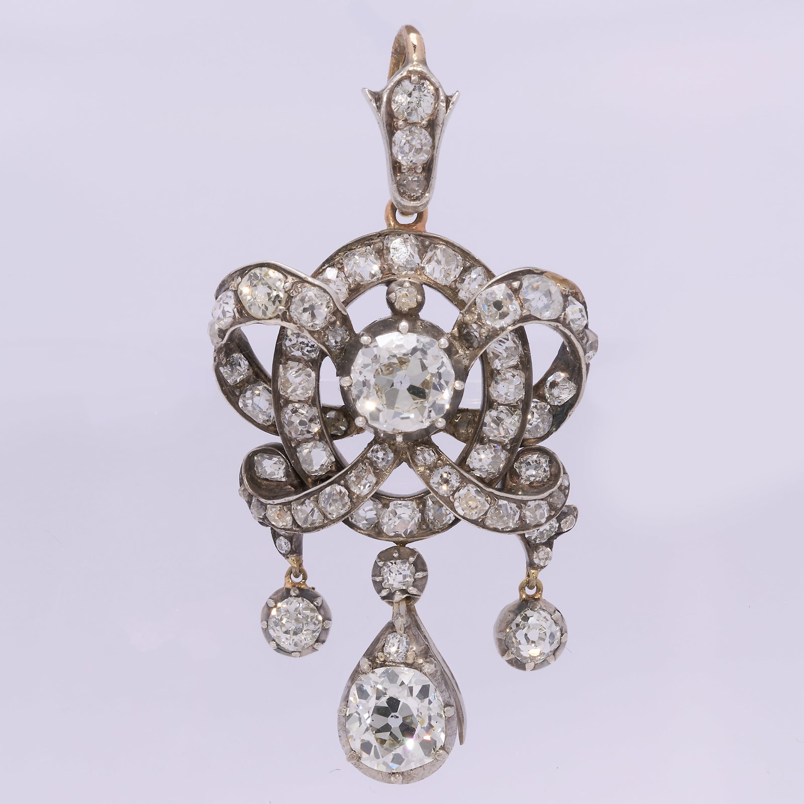 EXQUISITE VICTORIAN DIAMOND PENDANT, CIRCA 1880: EXQUISITE VICTORIAN DIAMOND PENDANT, CIRCA 1880 6.9 grams A beautifully intricate Victorian pendant set with approximately 4.55 carats of old-cut diamonds, featuring a principal diamond of 1.06 carats