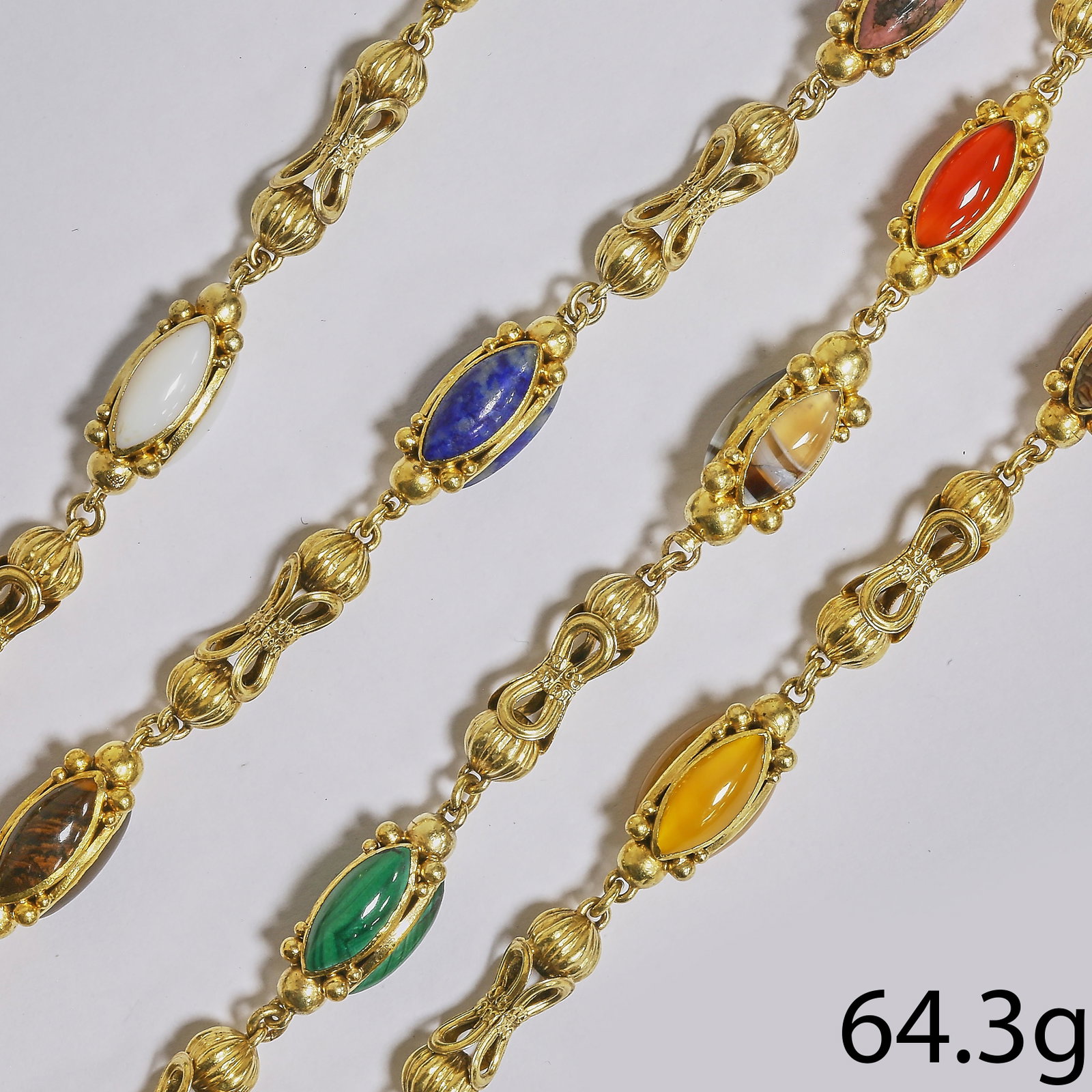 LOVELY VICTORIAN HARDSTONE NECKLACE: LOVELY VICTORIAN HARDSTONE NECKLACE,64.3 grams, testing 15 ct. gold.Alternated with a gold fancy link, and hardstone set links, including agate, lapis lazuli and carnelian.L. 85 cm.