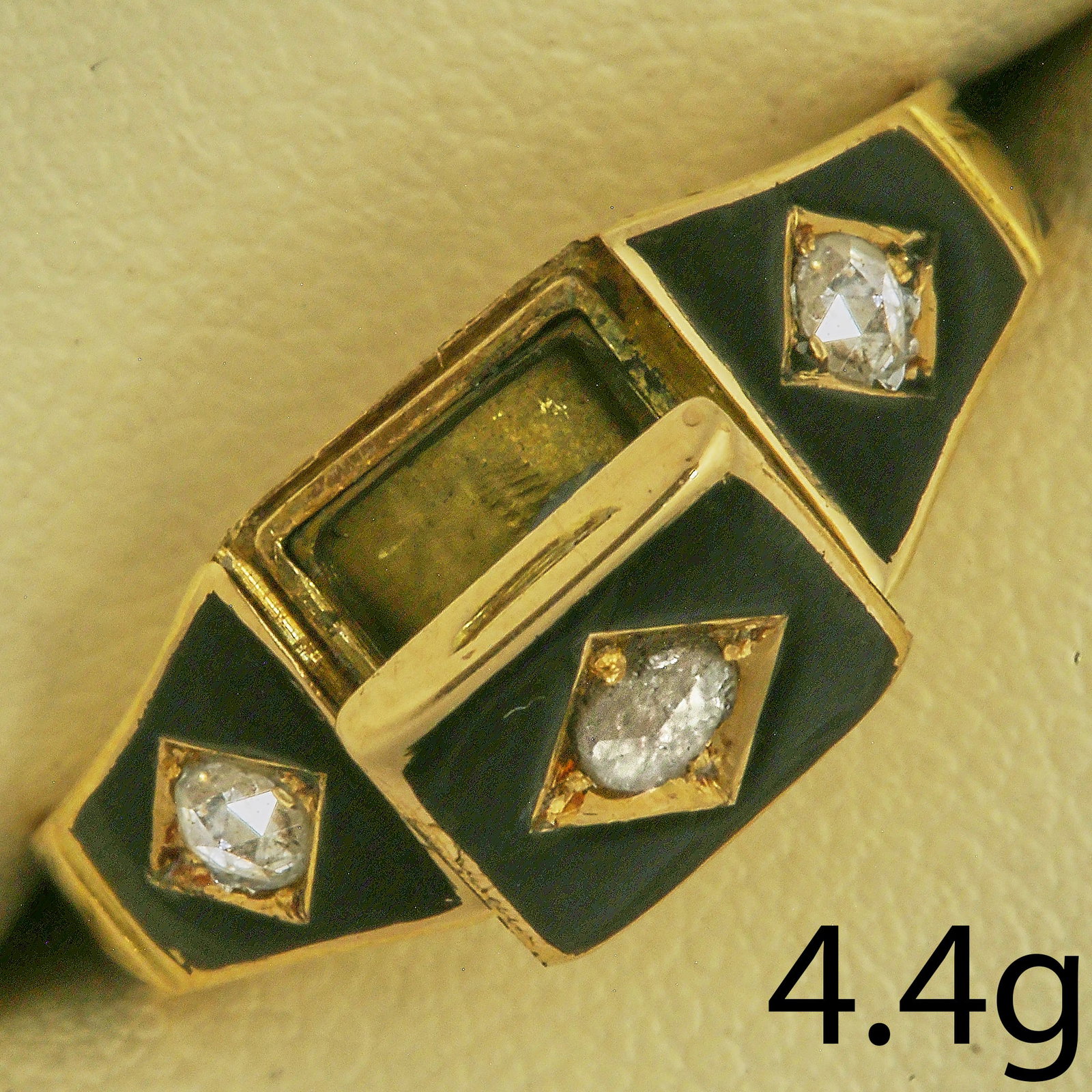 VICTORIAN ENAMEL AND DIAMOND POISON RING: VICTORIAN ENAMEL AND DIAMOND POISON RING4.4 grams, 18 ct gold. Full British hallmarks (Birmingham, 1879). With opening compartment.Size N 1/2.