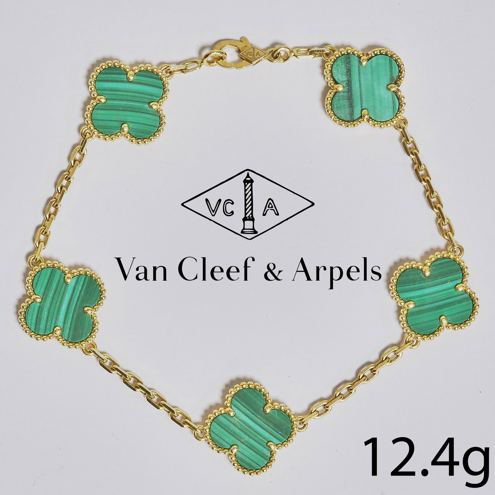 VAN CLEEF & ARPELS, ALHAMBRA MALACHITE BRACELET: VAN CLEEF & ARPELS, ALHAMBRA MALACHITE BRACELET,12,4 grams, 18 ct. gold.The bracelet of 5 motifs.Signed VCA and numbered.L. 20 cm.
