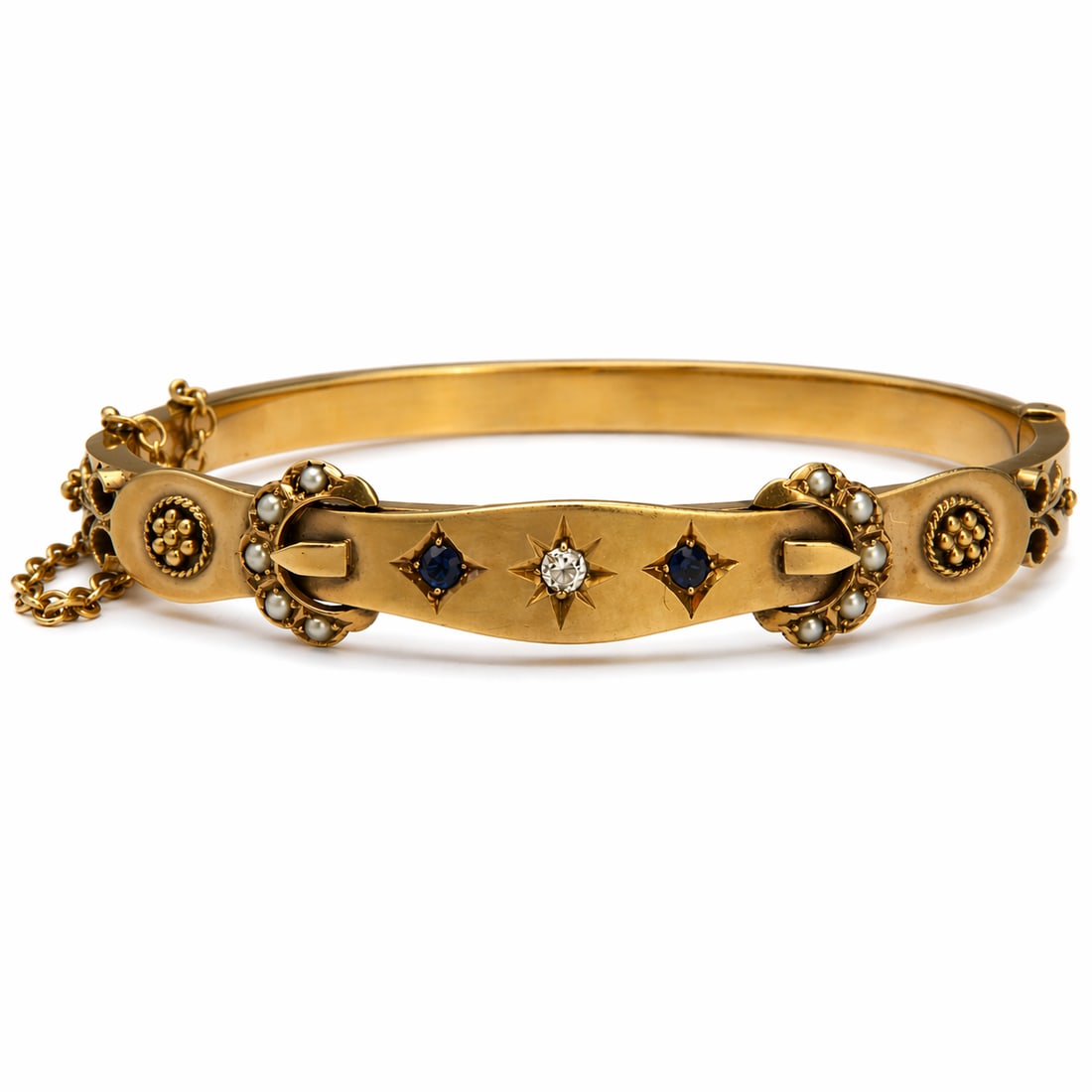 ANTIQUE SAPPHIRE, DIAMOND AND PEARL HINGED GOLD BANGLE: ANTIQUE SAPPHIRE, DIAMOND AND PEARL HINGED GOLD BANGLE,8.8 grams.Vibrant sapphires.Bright and lively diamond.Inner diam. 5.9 cm.