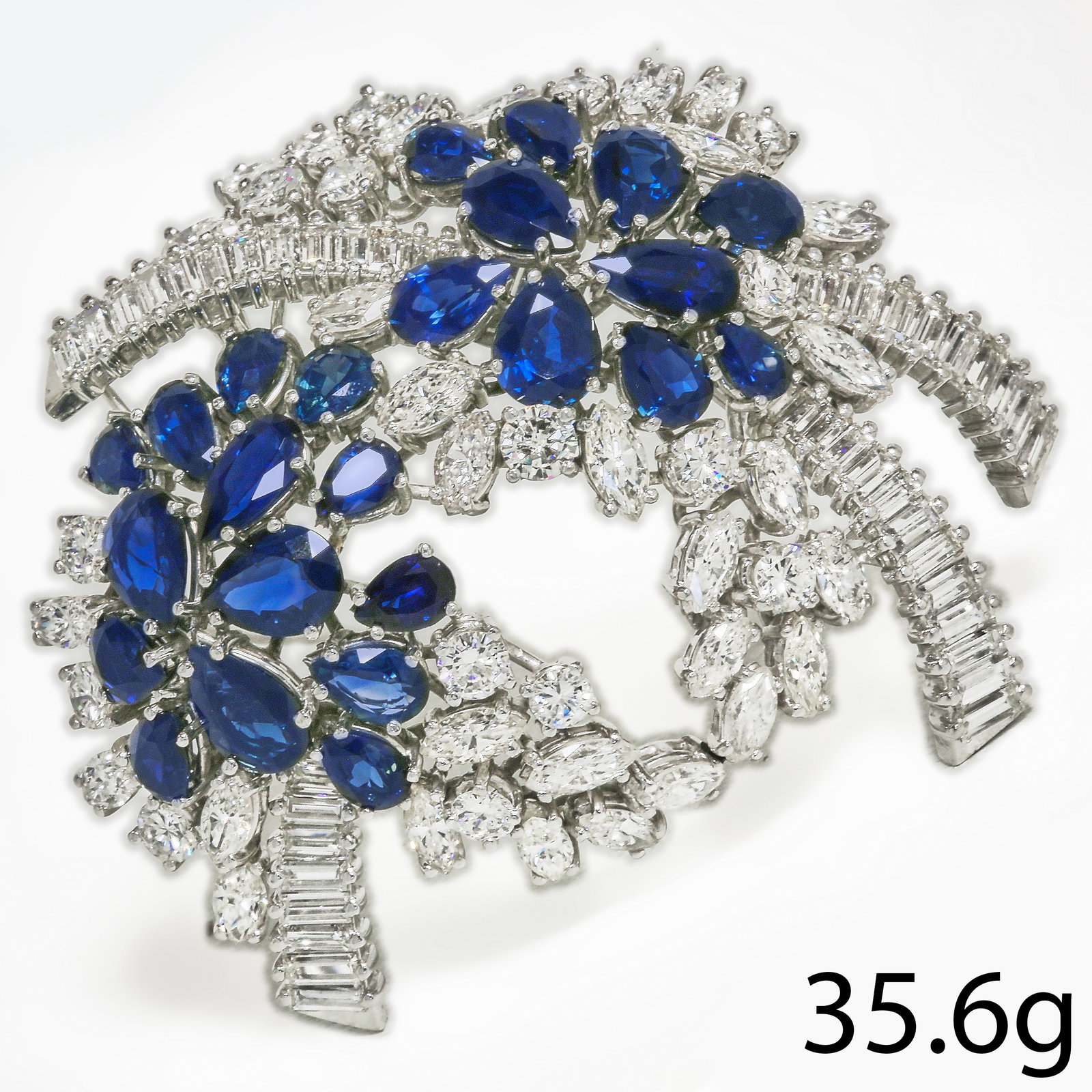 EDWARDIAN DIAMOND MARQUISE SHAPED RING: EDWARDIAN DIAMOND MARQUISE SHAPED RING,5.6 grams, testing platinum.Bright and lively old cut diamonds.Larger centre diamond of approx. 1.12 ct.Diamonds totalling approx. 5.20 ct.L. head 3.2 cm.Size O.