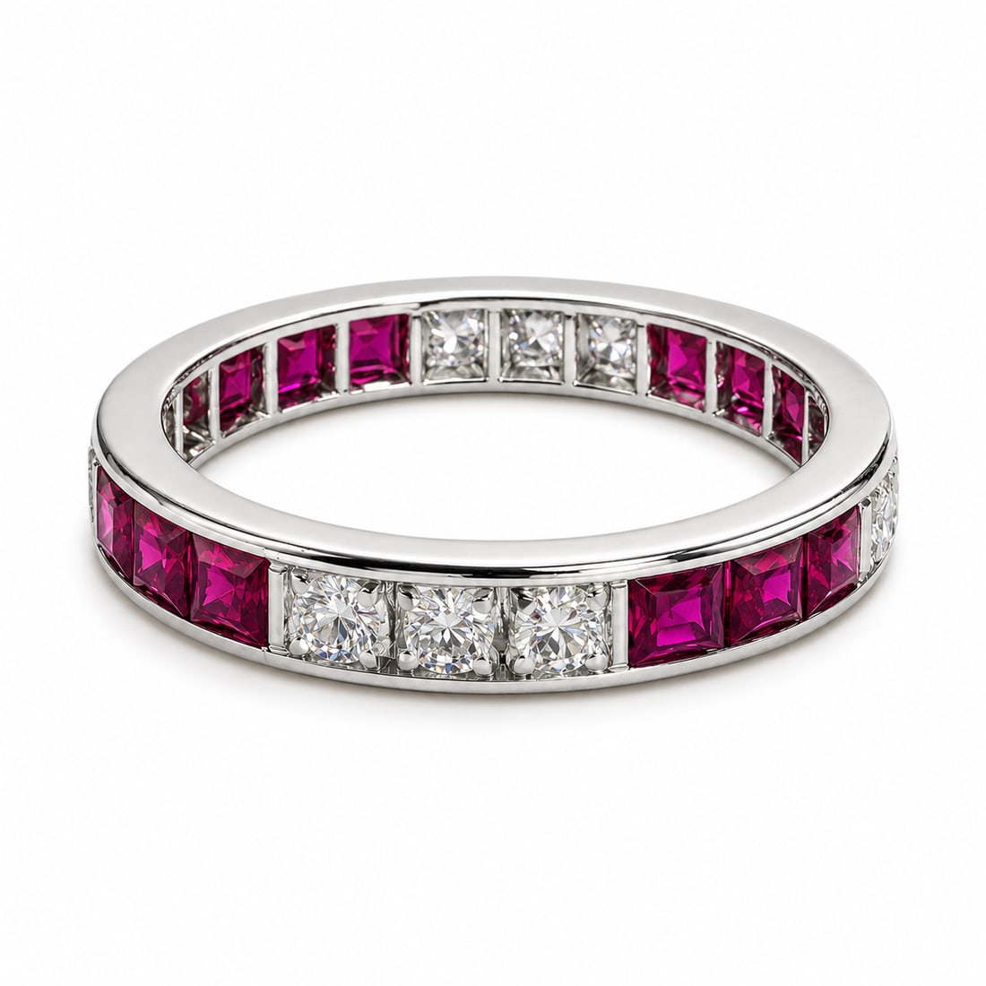 RUBY AND DIAMOND ETERNITY RING: RUBY AND DIAMOND ETERNITY RING,3,9 grams, testing high carat gold.Vibrant rubies, totalling approx. 1.20 ct.Diamonds bright and lively.Size Q.