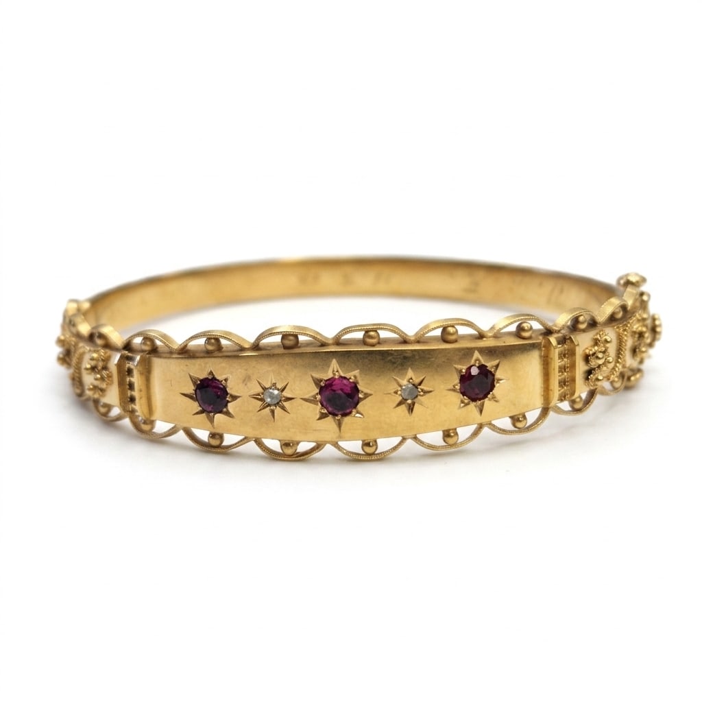 VICTORIAN RUBY AND DIAMOND HINGED GOLD BANGLE: VICTORIAN RUBY AND DIAMOND HINGED GOLD BANGLE,9.6 grams.Rich and vibrant rubies.Diamonds bright and lively.Inner diam. 5.8 cm.