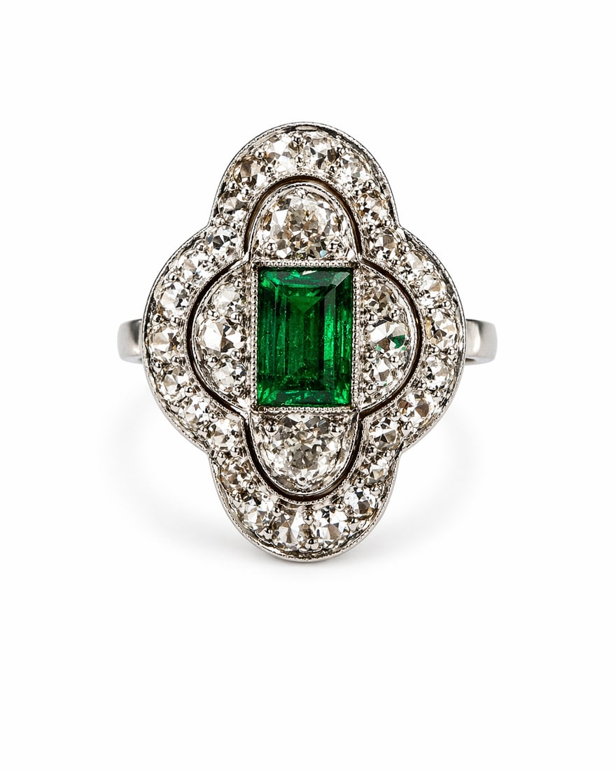 ART-DECO EMERALD AND DIAMOND CLUSTER RING: ART-DECO EMERALD AND DIAMOND CLUSTER RING,3,7 grams, testing high carat gold and platinum.Rich and vibrant emerald.Diamonds bright and lively.L. head 1.8 cm.Size M.
