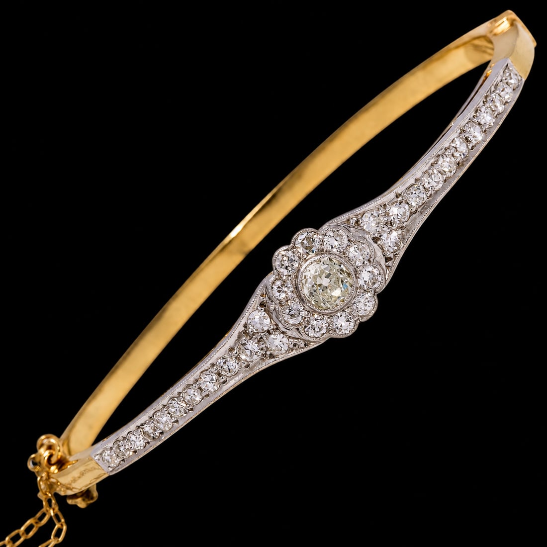 EDWARDIAN DIAMOND HINGED BANGLE: EDWARDIAN DIAMOND HINGED BANGLE 10.5 grams high carat gold and platinum bright lively old cut diamonds no dents in great condition