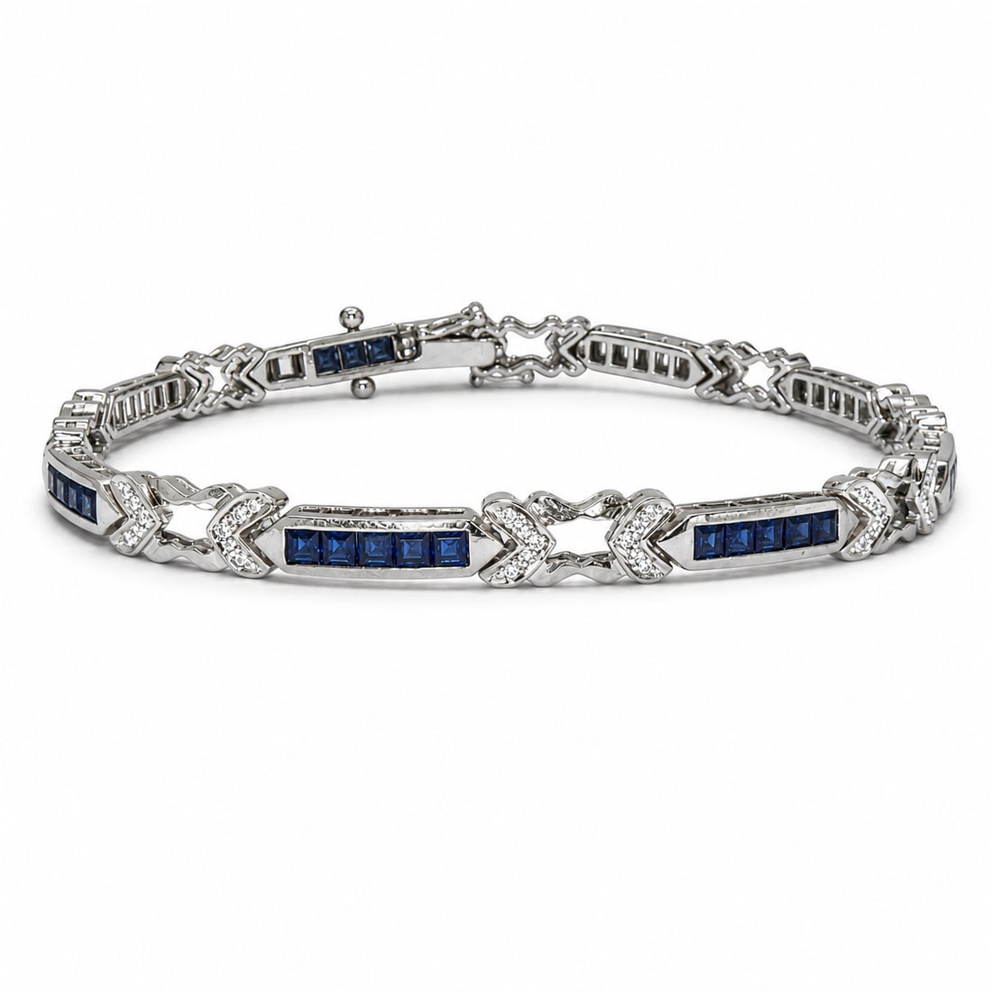 SAPPHIRE AND DIAMOND BRACELET: SAPPHIRE AND DIAMOND BRACELET,17.4 grams, testing 18 ct. gold.Bright and lively sapphires.Diamonds bright and lively.L. 17.5 cm.