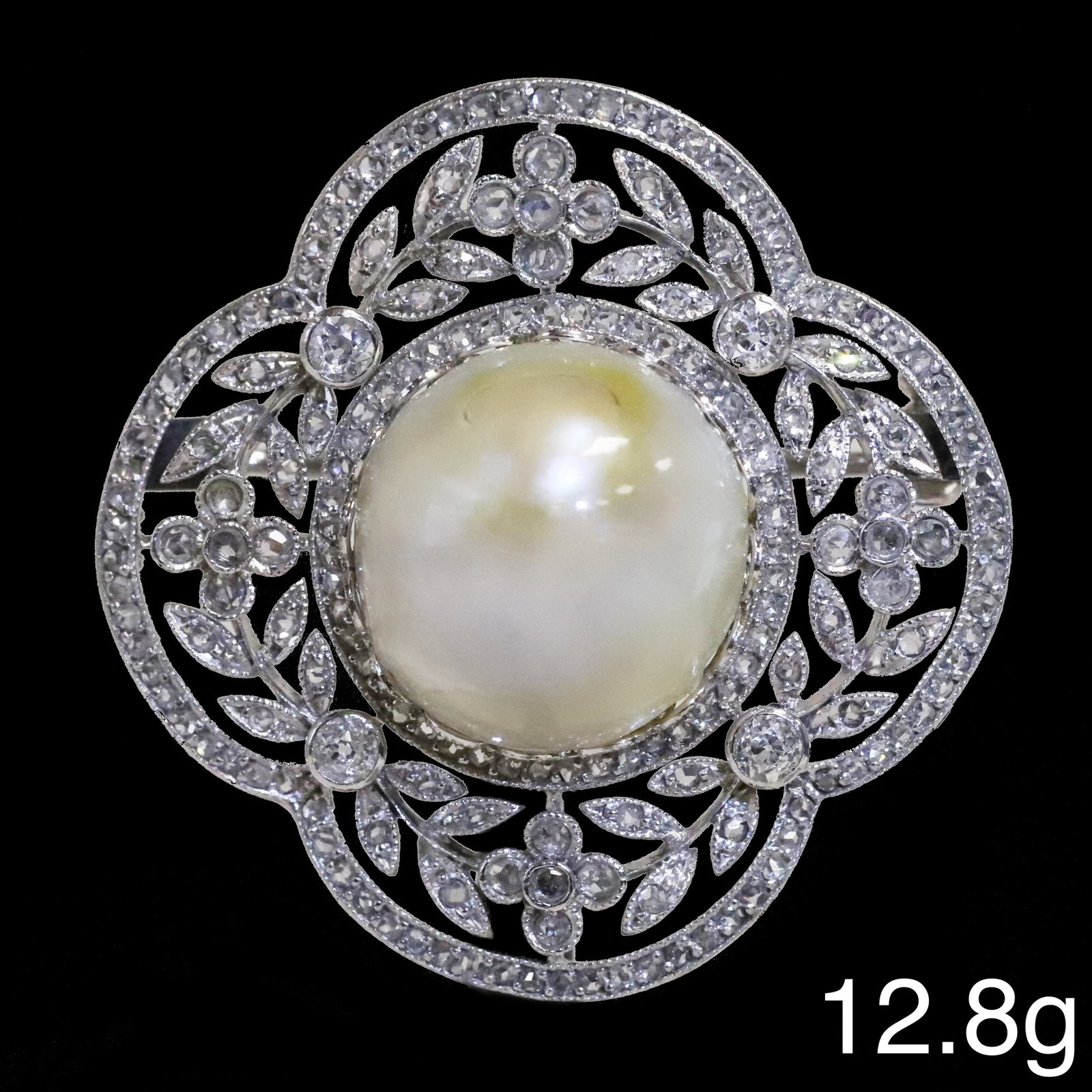 FANTASTIC BELLE EPOQUE CERTIFICATED NATURAL SALTWATER PEARL AND DIAMOND BROOCH: FANTASTIC BELLE EPOQUE CERTIFICATED NATURAL SALTWATER PEARL AND DIAMOND BROOCH,12.8 grams, testing platinum.Fine and large natural saltwater pearl of approx. 14,66 x 14,03 x 10,19 mm. 14,28 ct. (Certi