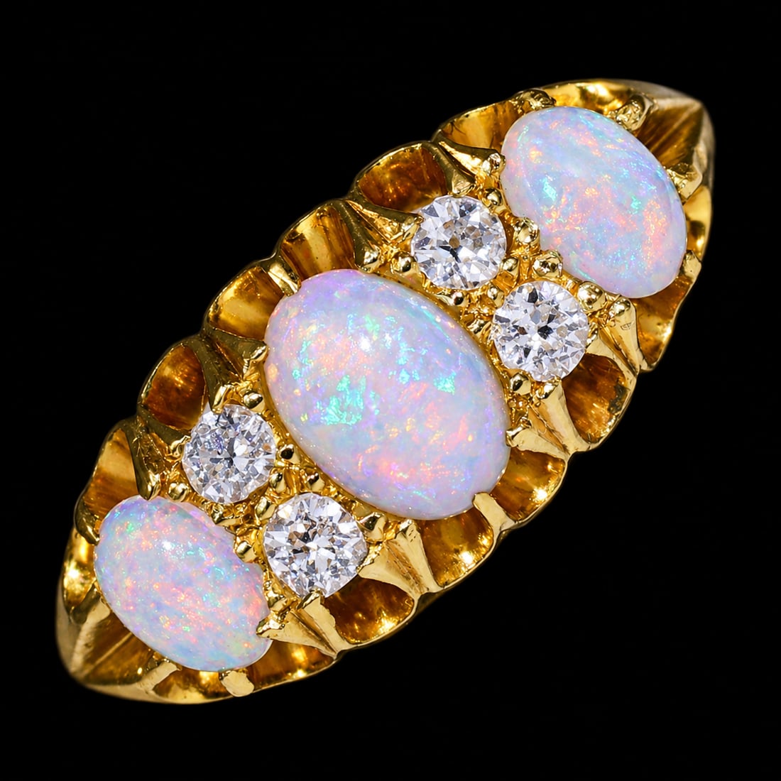 ANTIQUE OPAL AND DIAMOND RING: ANTIQUE OPAL AND DIAMOND RING,4,1 grams, 18 ct. gold.Rich and vibrant opals with good play of colour including red.Diamonds bright and lively.Size J 1/2.