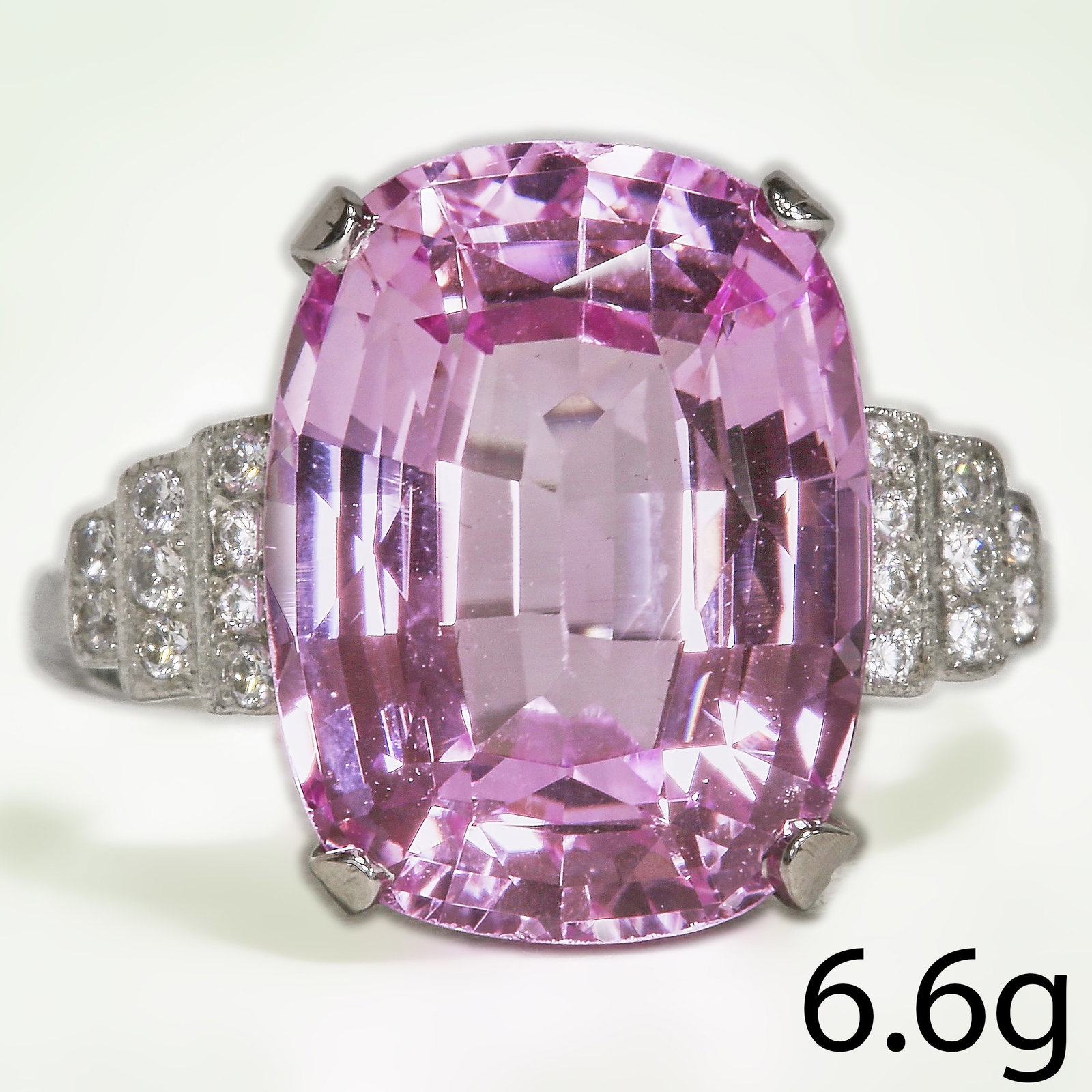 KUNZITE AND DIAMOND RING: KUNZITE AND DIAMOND RING,6 grams, testing high carat gold.Rich and vibrant kunzite of approx. 6.60 ct.Diamonds bright and lively.Size N 1/2.
