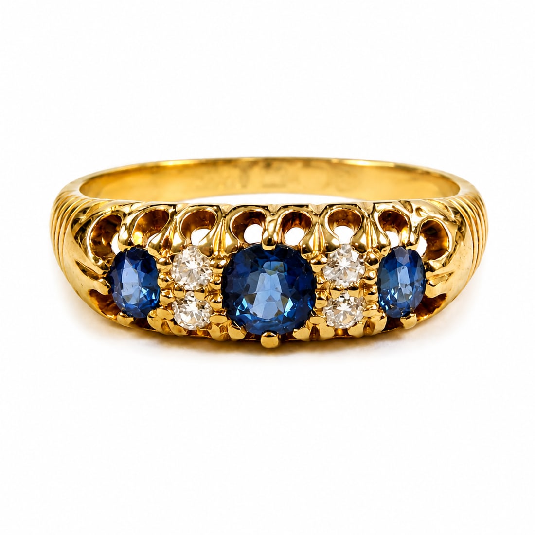 SAPPHIRE AND DIAMOND RING: SAPPHIRE AND DIAMOND RING,5 grams, 18 ct. gold.Rich and vibrant sapphires.Diamonds bright and lively.Size O.