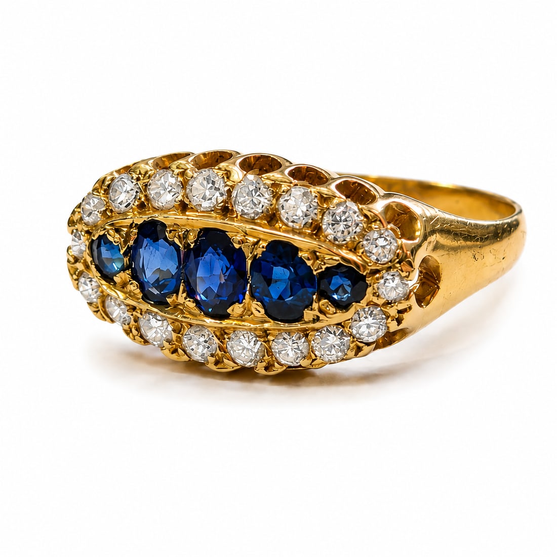 SAPPHIRE AND DIAMOND RING: SAPPHIRE AND DIAMOND RING,18 ct. gold.Rich and vibrant sapphires.Diamonds bright and lively.Size M.