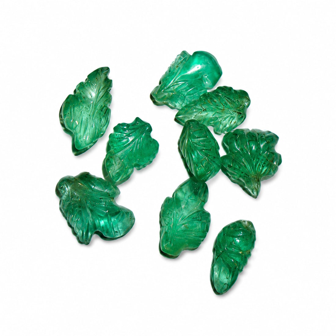 LOT OF CARVED EMERALDS, TOTALLING APPROX. 7,74 CT.: LOT OF CARVED EMERALDS, TOTALLING APPROX. 7,74 CT.