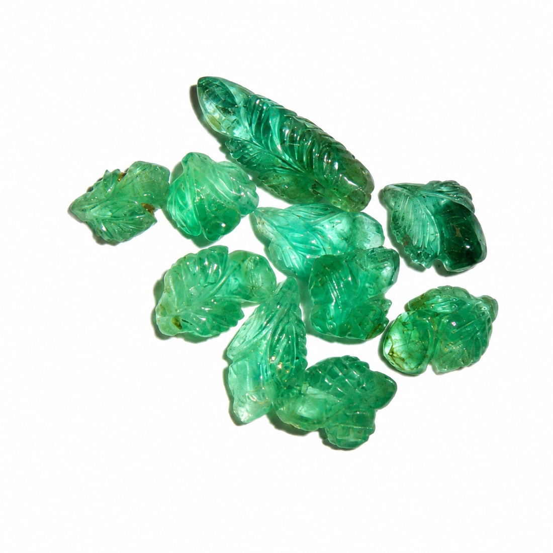 LOT OF CARVED EMERALDS, TOTALLING APPROX.10.02 CT.: LOT OF CARVED EMERALDS, TOTALLING APPROX.10.02 CT.