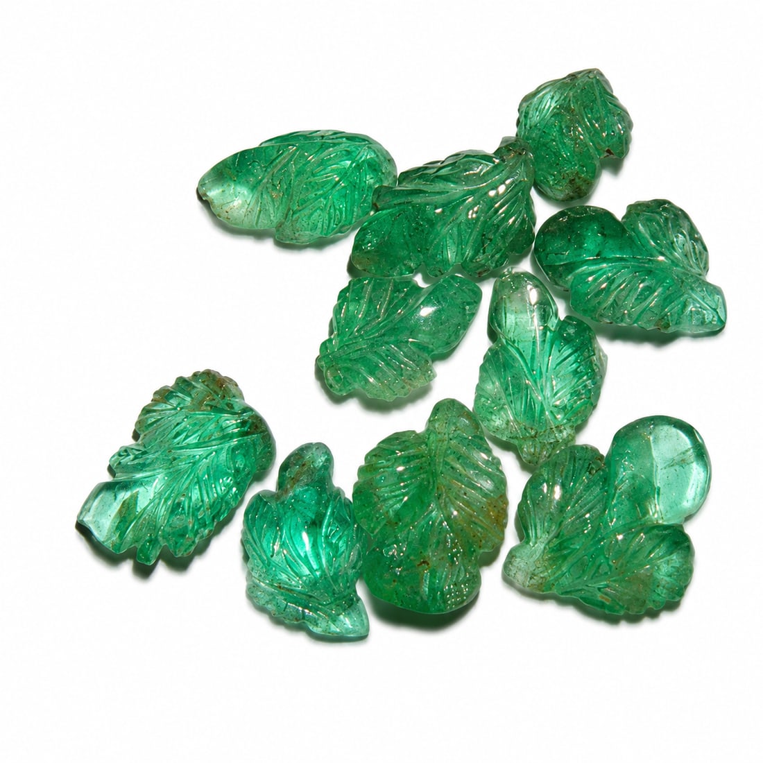 LOT OF CARVED EMERALDS, TOTALLING APPROX. 10.20 CT.: LOT OF CARVED EMERALDS, TOTALLING APPROX. 10.20 CT.