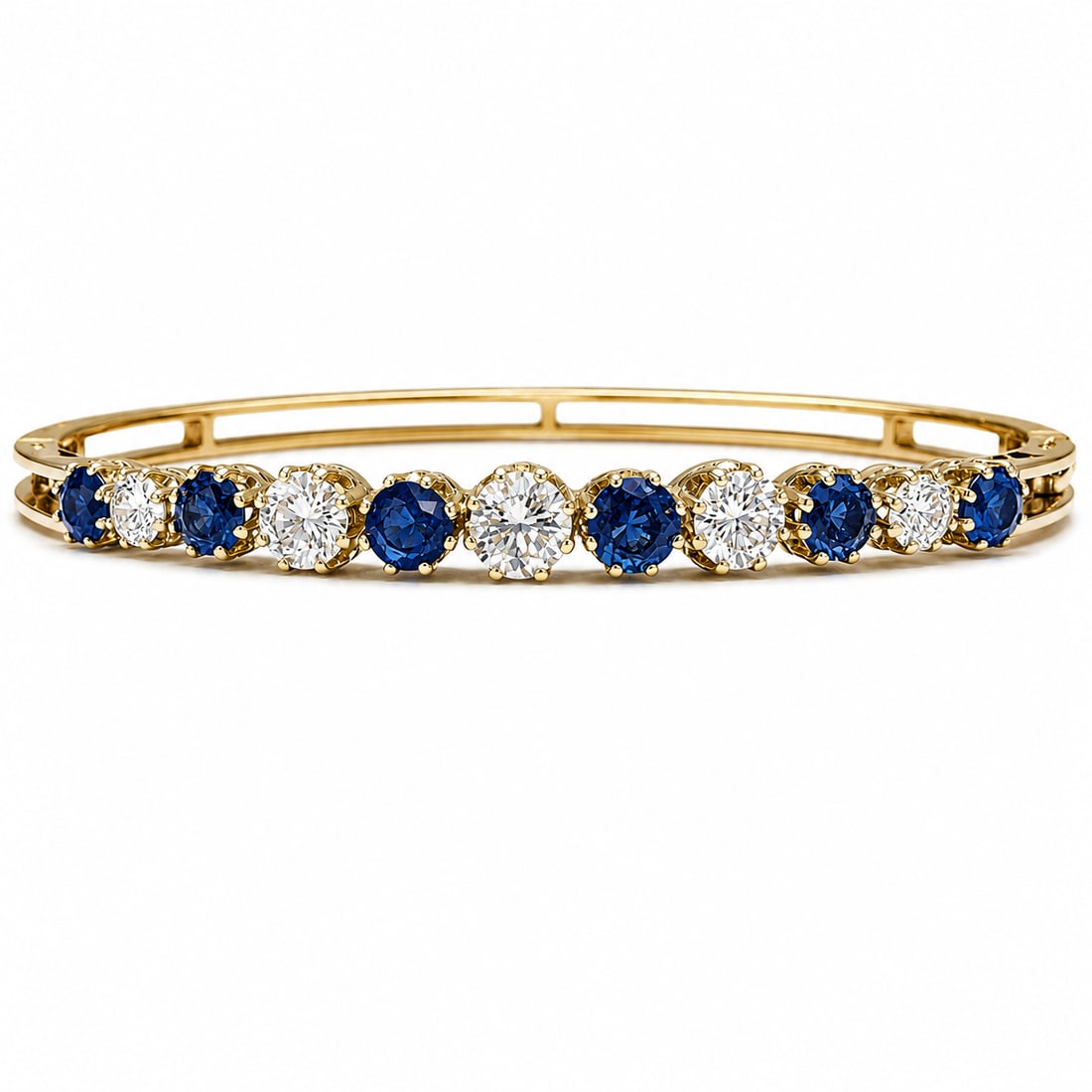 ANTIQUE SAPPHIRE AND DIAMOND BANGLE: ANTIQUE SAPPHIRE AND DIAMOND BANGLE15.9 grams. high carat gold Bright and lively diamonds totalling approx. 1.65 ct. Vibrant sapphires approx. 1.90 ct. Inner diameter 5.9 cm.