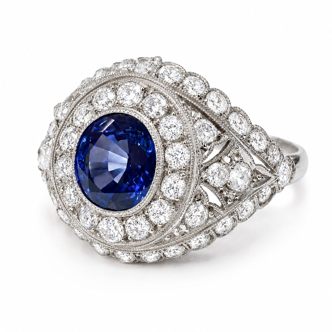 SAPPHIRE AND DIAMOND CLUSTER RING: SAPPHIRE AND DIAMOND CLUSTER RING 4.8 grams high carat gold and platinum rich vibrant sapphire with no abrasions approx. 2.47 ct. bright lively diamonds approx. 1 ct. size O fine craftsmanship