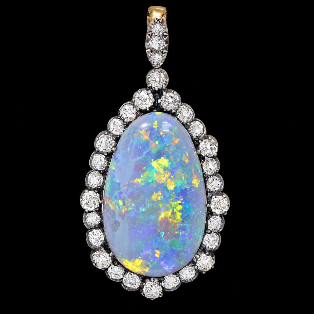 FANTASTIC ANTIQUE BLACK OPAL AND DIAMOND PENDANT: FANTASTIC ANTIQUE BLACK OPAL AND DIAMOND PENDANT,8,5 grams, testing high carat gold and silver.Fantastic large black opal of approx. 16 ct. with great play of colour.Bright and lively old cut diamonds