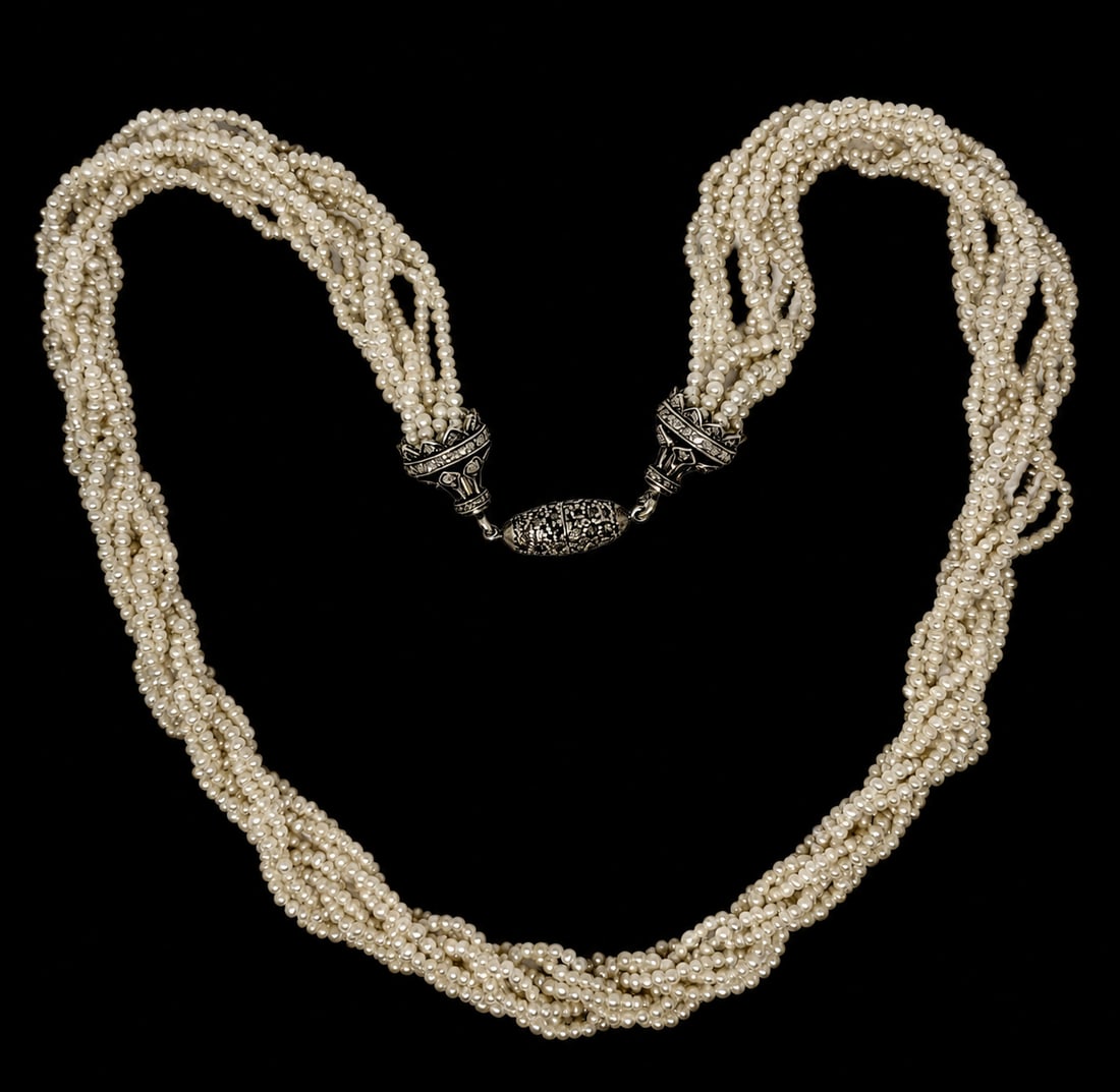 EDWARDIAN MULTI STRAND PEARL NECKLACE,: EDWARDIAN MULTI STRAND PEARL NECKLACE,22,6 grams.Diamond set clasp.Pearls generally well matched.L. 41 cm.