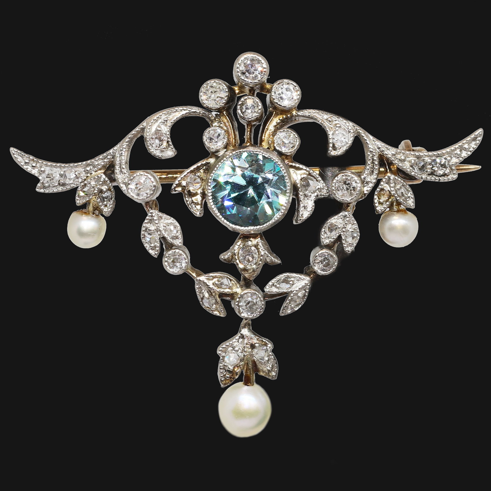 EDWARDIAN ZIRCON DIAMOND AND PEARL BROOCH,: EDWARDIAN ZIRCON DIAMOND AND PEARL BROOCH,5,3 grams, Testing high carat gold and silver.Rich and vibrant zircon.Diamonds bright and lively.Sweet pearl drops (untested, believed to be natural).W. 3.6