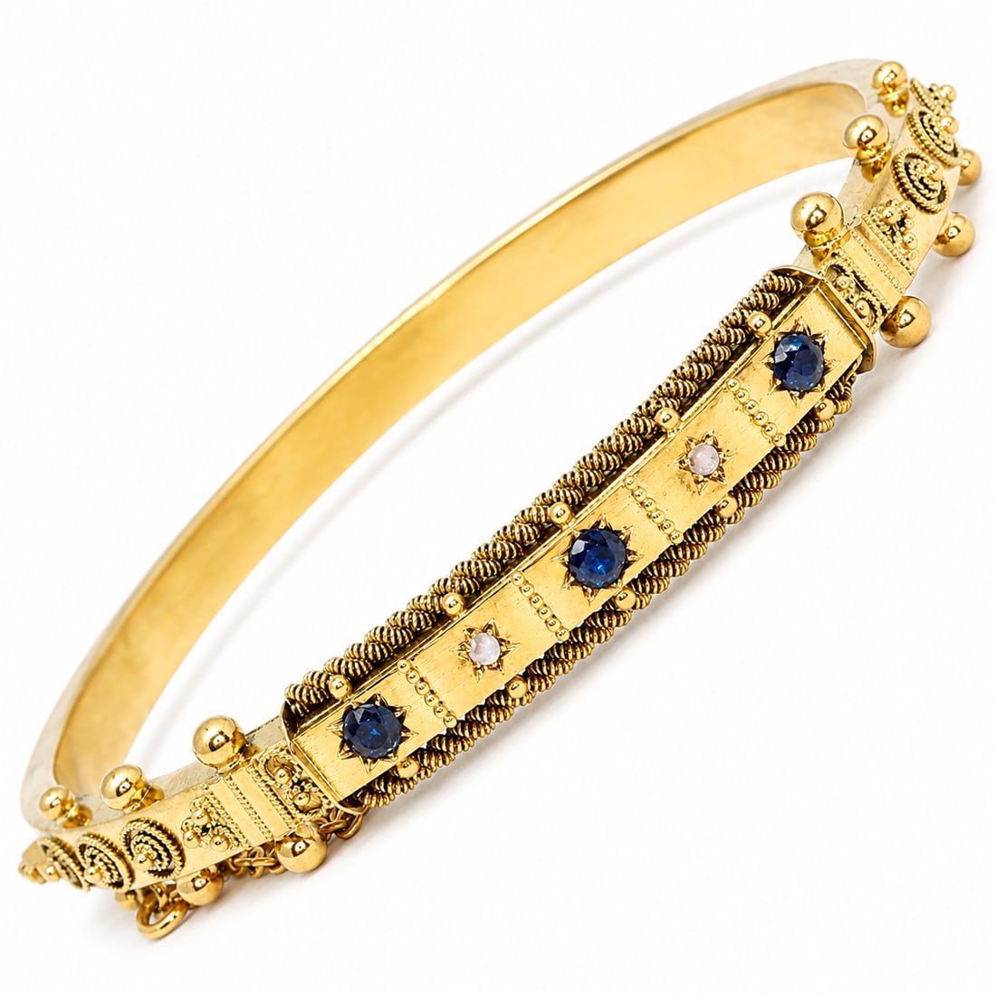 ANTIQUE SAPPHIRE AND DIAMOND HINGED BANGLE: ANTIQUE SAPPHIRE AND DIAMOND HINGED BANGLE,11.9 grams, testing 15 ct. gold.Vibrant sapphires.Inner diam. 5.7 cm.