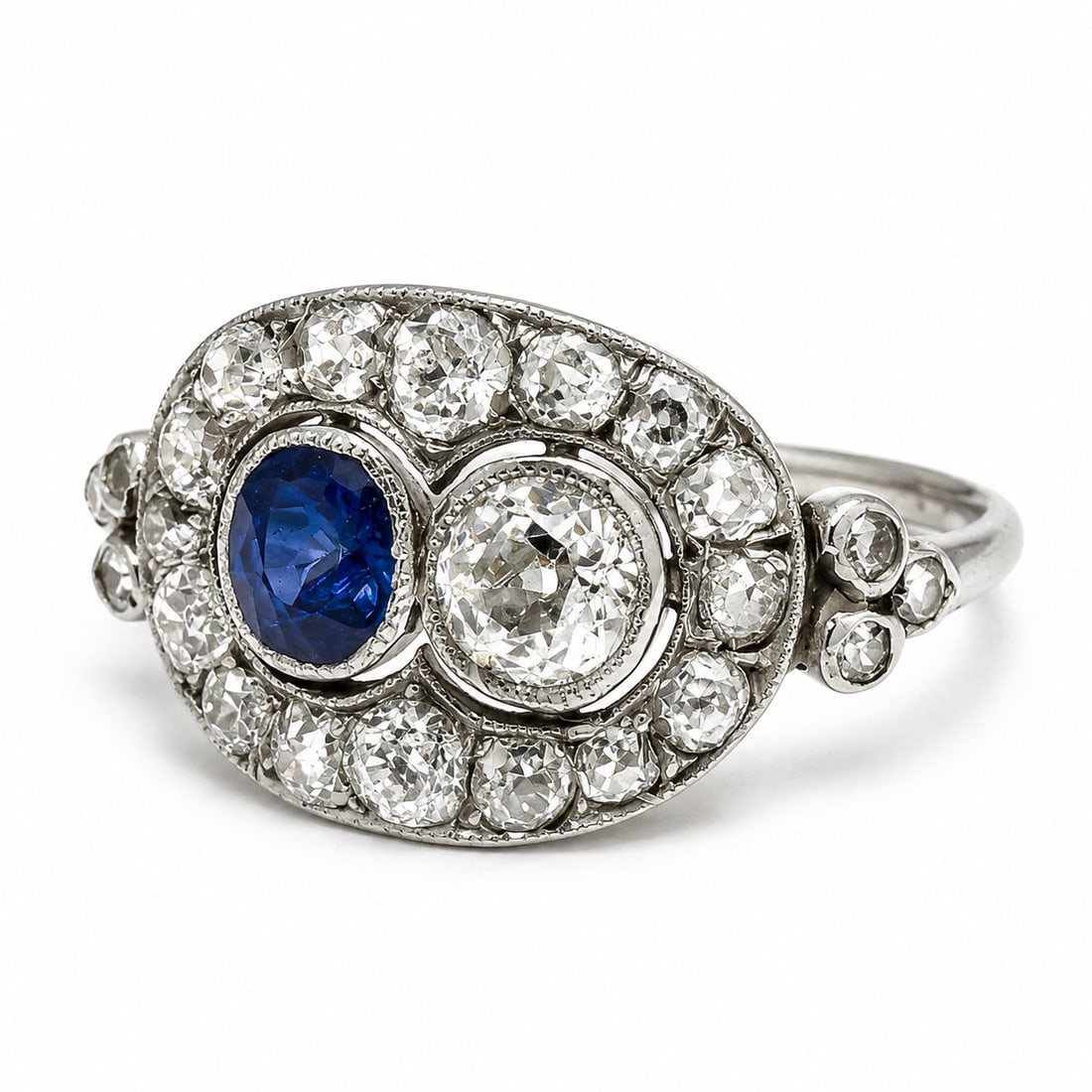 ART-DECO SAPPHIRE AND DIAMOND CLUSTER RING: ART-DECO SAPPHIRE AND DIAMOND CLUSTER RING,testing platinum.Bright and lively diamonds.Rich and vibrant sapphire.Size Q.