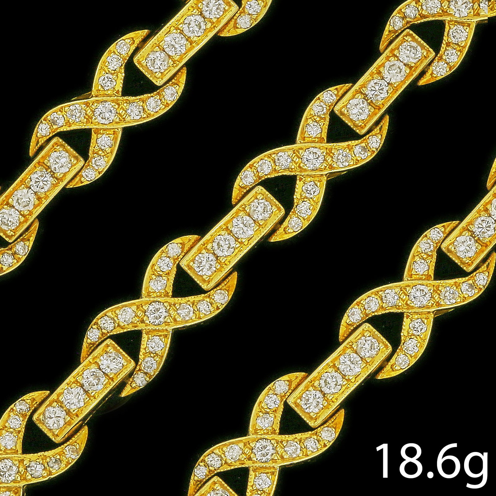 DIAMOND BRACELET: DIAMOND BRACELET,18.6 grams, testing 18 ct. gold.Bright and lively diamonds, totalling approx. 2.20 ct.L. 18 cm.