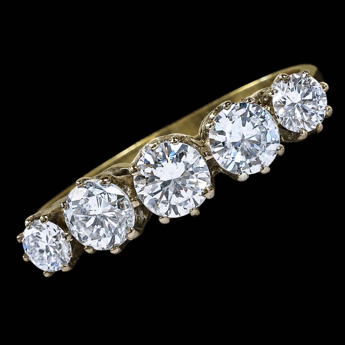 DIAMOND 5-STONE RING: DIAMOND 5-STONE RING,3.6 grams, 18 ct. gold.Diamonds bright and lively, totalling approx. 1..55 ct.Size O 1/2.