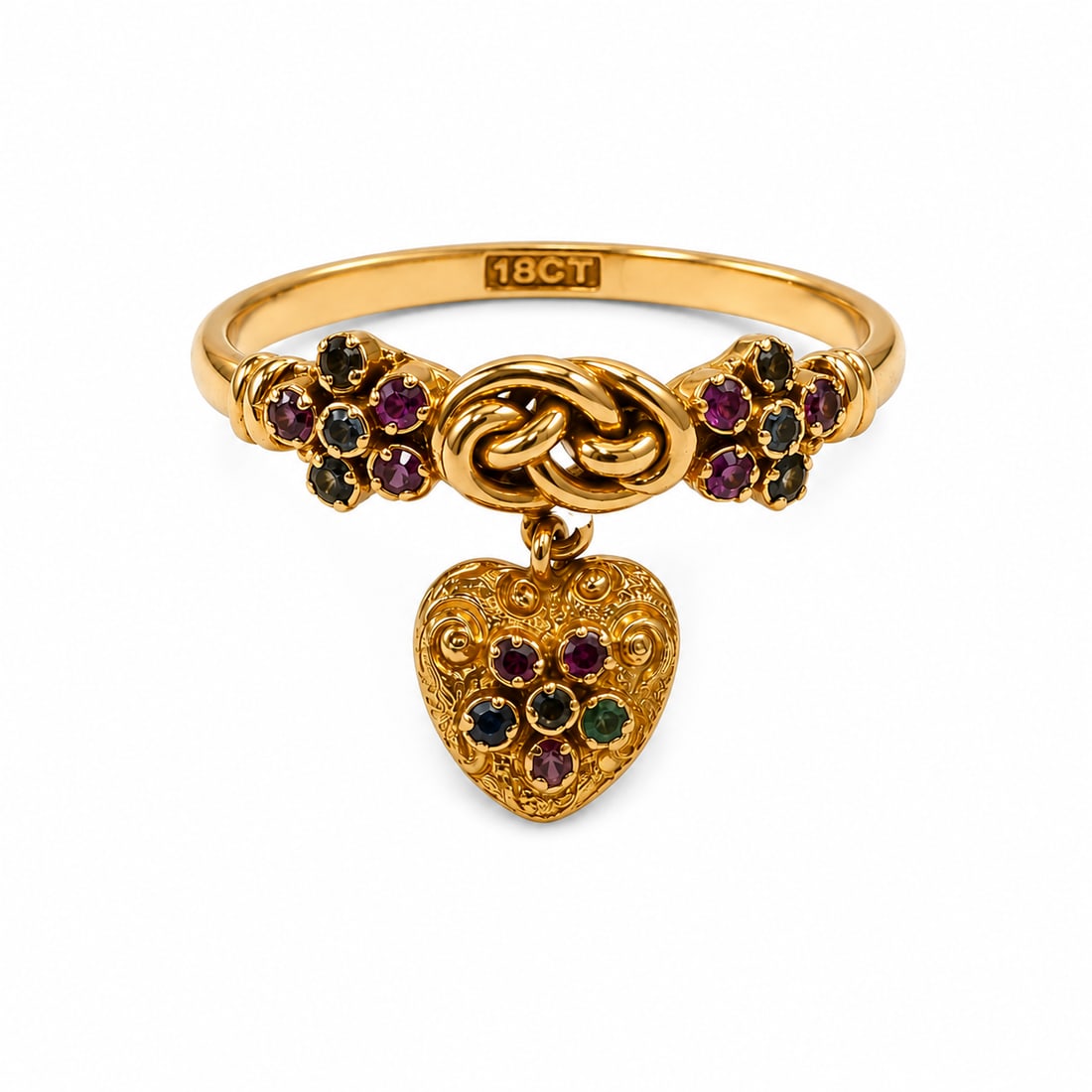 RARE ANTIQUE LOVERS KNOT RUBY AND EMERALD RING WITH HEART LOCKET: RARE ANTIQUE LOVERS KNOT RUBY AND EMERALD RING WITH HEART LOCKET,18 ct. gold.Of fine lovers knot design. The shoulders in floral cluster motif, set with rubies and emeralds.Suspending a ruby and