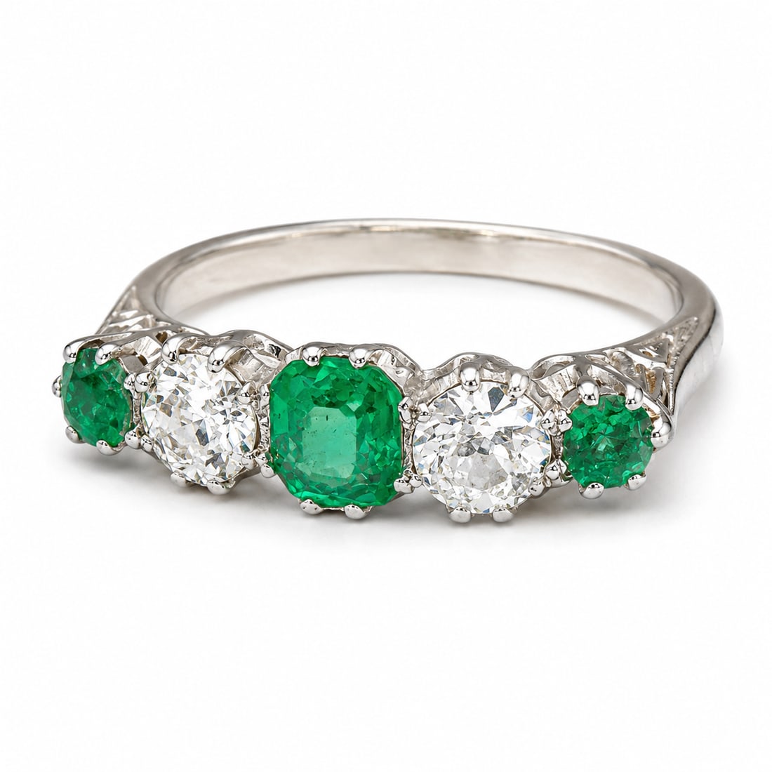 EMERALD AND DIAMOND 5-STONE RING: EMERALD AND DIAMOND 5-STONE RING,18 ct. gold and platinum.Rich and vibrant emeralds (likely Colombian).Diamonds bright and lively.Size L 1/2.