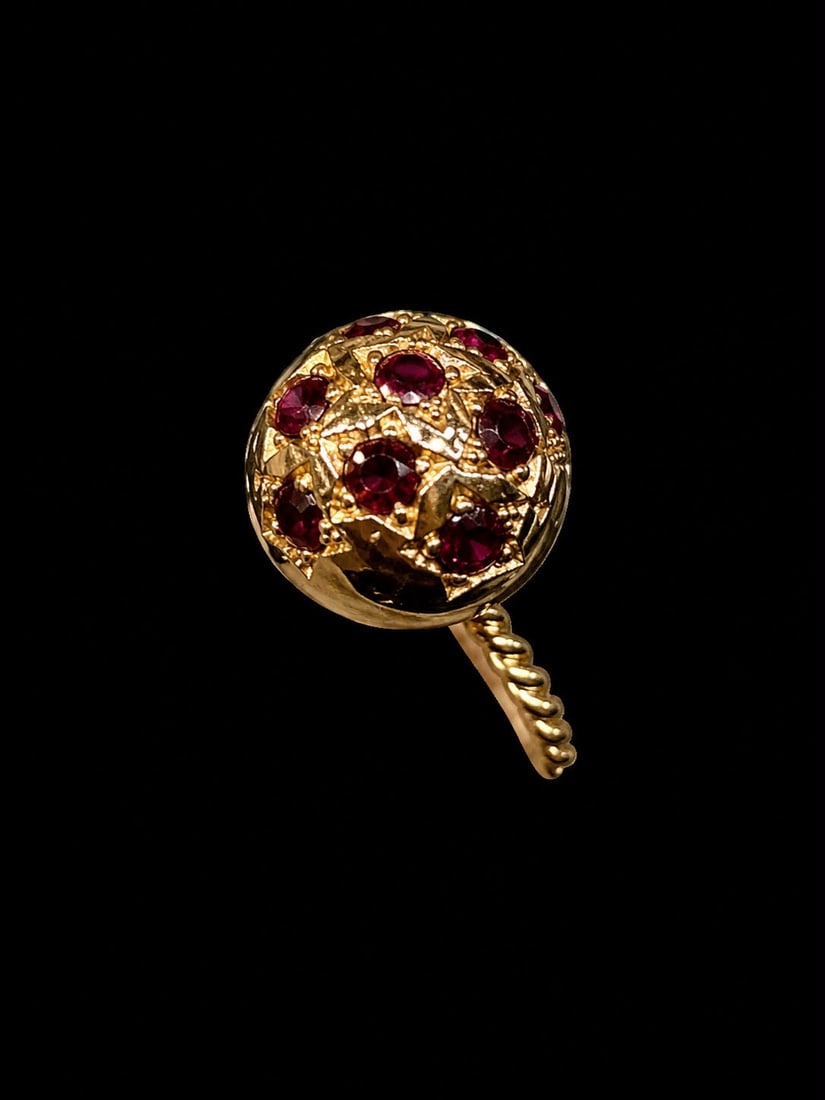 RETRO RUBY SPHERE RING: RETRO RUBY SPHERE RING,6,1 grams, testing 18 ct. gold.The sphere set with lovely rubies.The shank of twisted design.Size H.