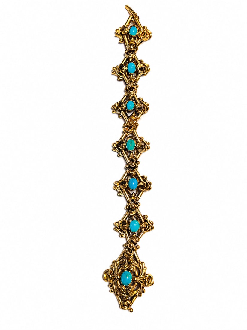 VICTORIAN TURQUOISE BRACELET: VICTORIAN TURQUOISE BRACELET,21 grams, testing high carat gold.Vibrant turquoise.The links with lovely relief decoration.L., 19.5 cm.