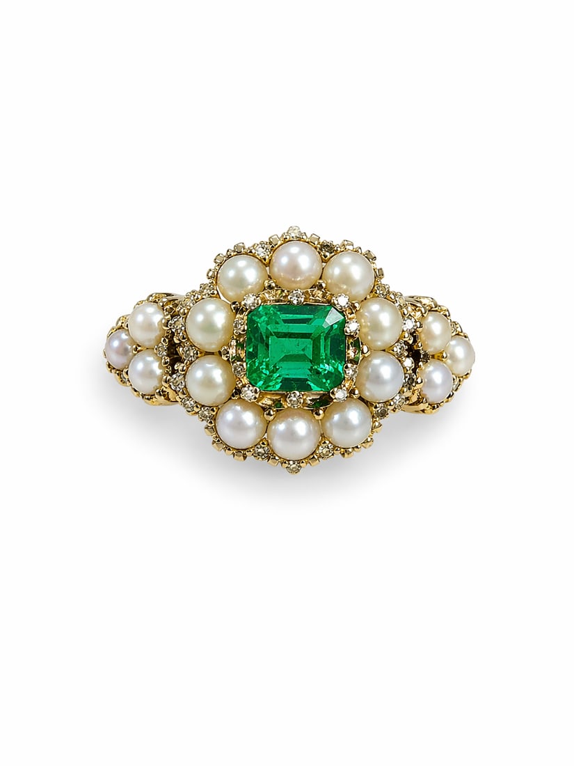 GEORGIAN EMERALD AND PEARL CLUSTER RING: GEORGIAN EMERALD AND PEARL CLUSTER RING,3.8 grams, testing high carat gold.Rich and vibrant emerald with great clarity and lustre.Fine pearls.Part relief floral decorated shank.Size K 1/2
