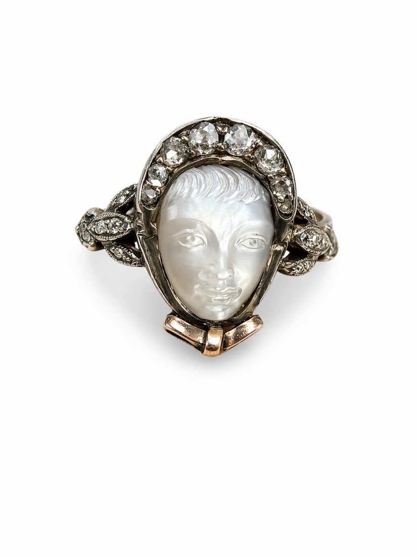 FINE CARVED ANTIQUE MOONSTONE WOMAN WITH BONNET HAT DIAMOND RING: FINE CARVED ANTIQUE MOONSTONE WOMAN WITH BONNET HAT DIAMOND RING,4,3 grams, testing high carat gold and silver.The moonstone beautifully carved as the face of a woman, wearing a diamond set bonnet.Dia
