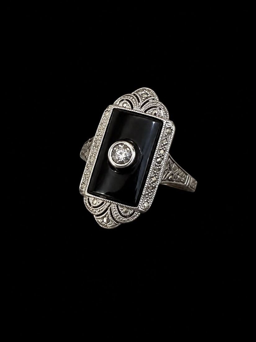 SWEET ART-DECO ONYX AND DIAMOND RING: SWEET ART-DECO ONYX AND DIAMOND RING,testing high carat gold.Bright and lively diamonds.Lovely carved onyx to the centre.Size L.