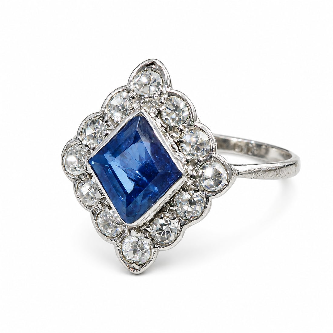 ART-DECO SAPPHIRE AND DIAMOND RING: ART-DECO SAPPHIRE AND DIAMOND RING,testing platinum.Rich and vibrant sapphire of approx. 1.15 ct.Diamonds bright and lively.Size Q.