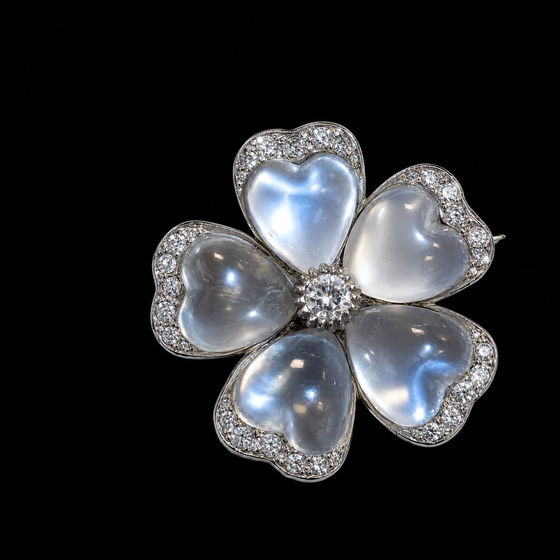 FINE ANTIQUE MOONSTONE AND DIAMOND FLORAL BROOCH: FINE ANTIQUE MOONSTONE AND DIAMOND FLORAL BROOCH,8.7 grams, testing high carat gold and silver.Rich and vibrant moonstones with blue shiller.Diamonds bright and lively.W. 2.7 cm.