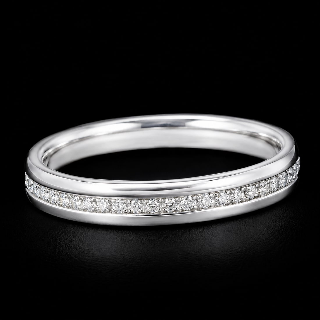 TIFFANY & CO., DIAMOND ETERNITY RING: TIFFANY & CO., DIAMOND ETERNITY RING2.6 grams, marked 18 carat gold. Bright and lively diamonds. Quality craftsmanship. Size K 1/2. In Tiffany & Co. box and outer box.