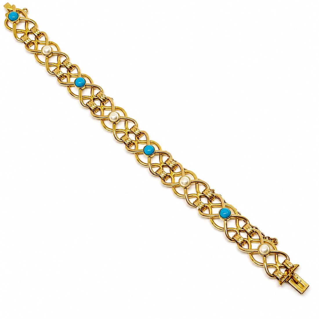 EDWARDIAN TURQUOISE AND PEARL BRACELET: EDWARDIAN TURQUOISE AND PEARL BRACELET,19.1 grams, 15 ct. gold.Alternately set with a turquoise and pearl.L. 18.5 cm.