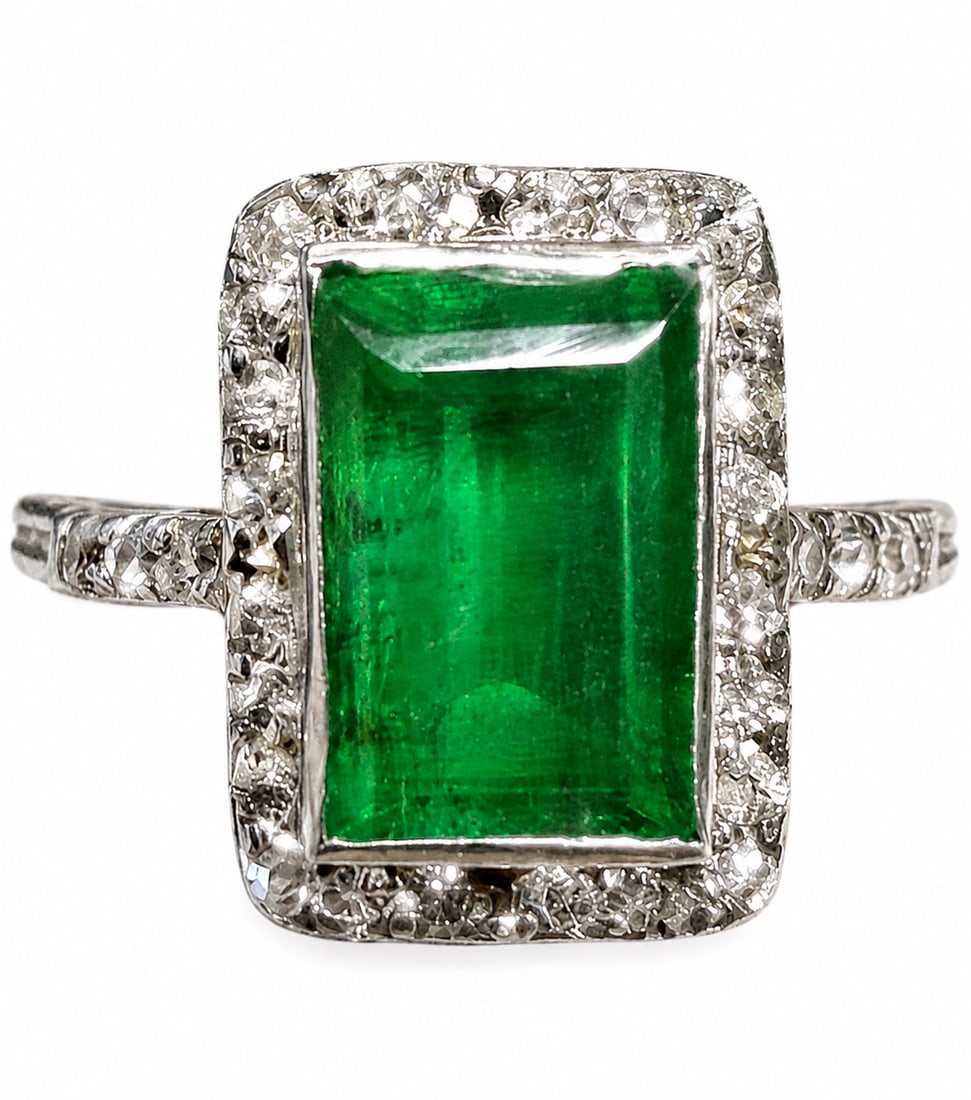 ART-DECO EMERALD AND DIAMOND CLUSTER RING: ART-DECO EMERALD AND DIAMOND CLUSTER RING,testing platinum.Rich and vibrant emerald of approx. 1.85 ct.Diamonds bright and lively.Size J 1/2