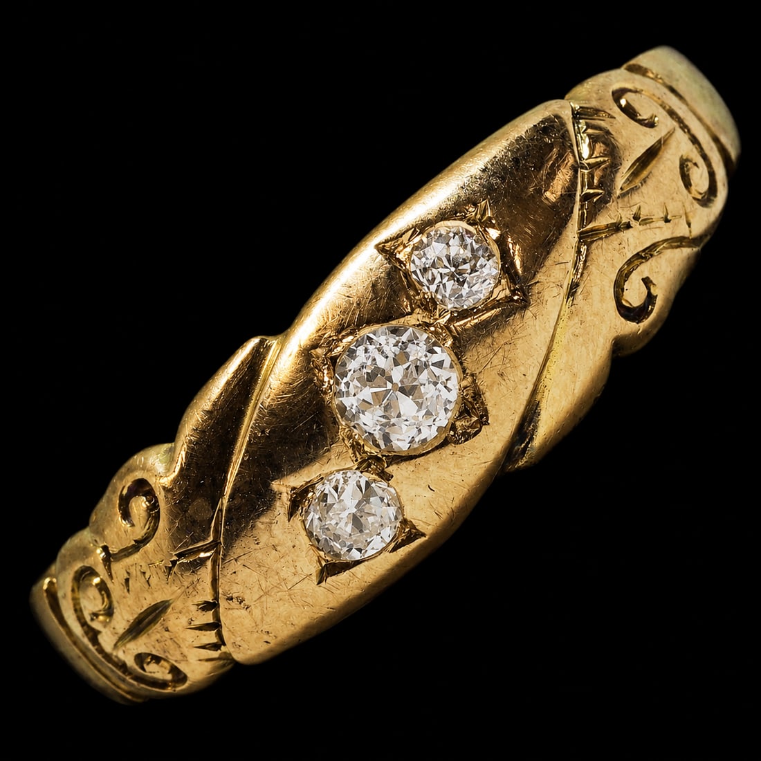 3-STONE DIAMOND GYPSY RING: 3-STONE DIAMOND GYPSY RING,testing 18 ct. gold.Bright and lively old cut diamonds.Size N.