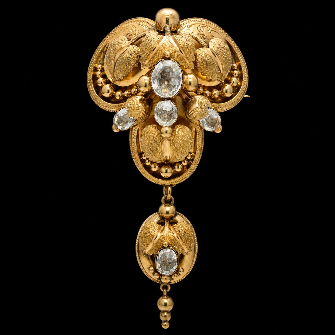 VICTORIAN AQUAMARINE BROOCH: VICTORIAN AQUAMARINE BROOCH,9.2 grams, testing high carat gold. Lovely 3-dimensional floral design.Bottom drop removable.L. 7,4 cm.