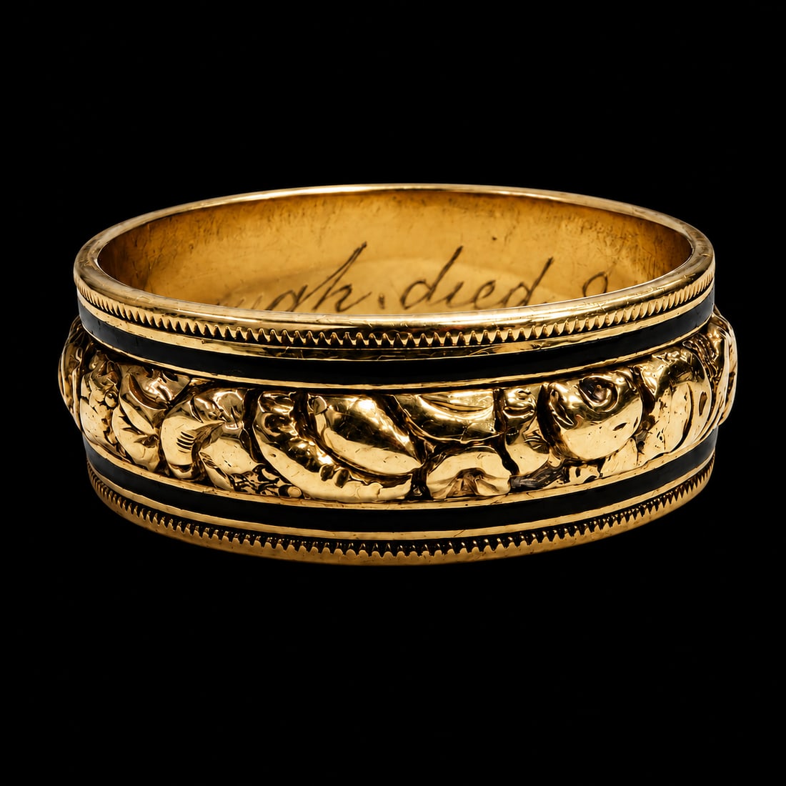 GEORGIAN ENAMEL RING: GEORGIAN ENAMEL RING,5,2 grams, testing high carat gold.The centre section with fine relief decoration, with a band of enamel on each side.Inside of the shank with text and dated: 1819.Size S.