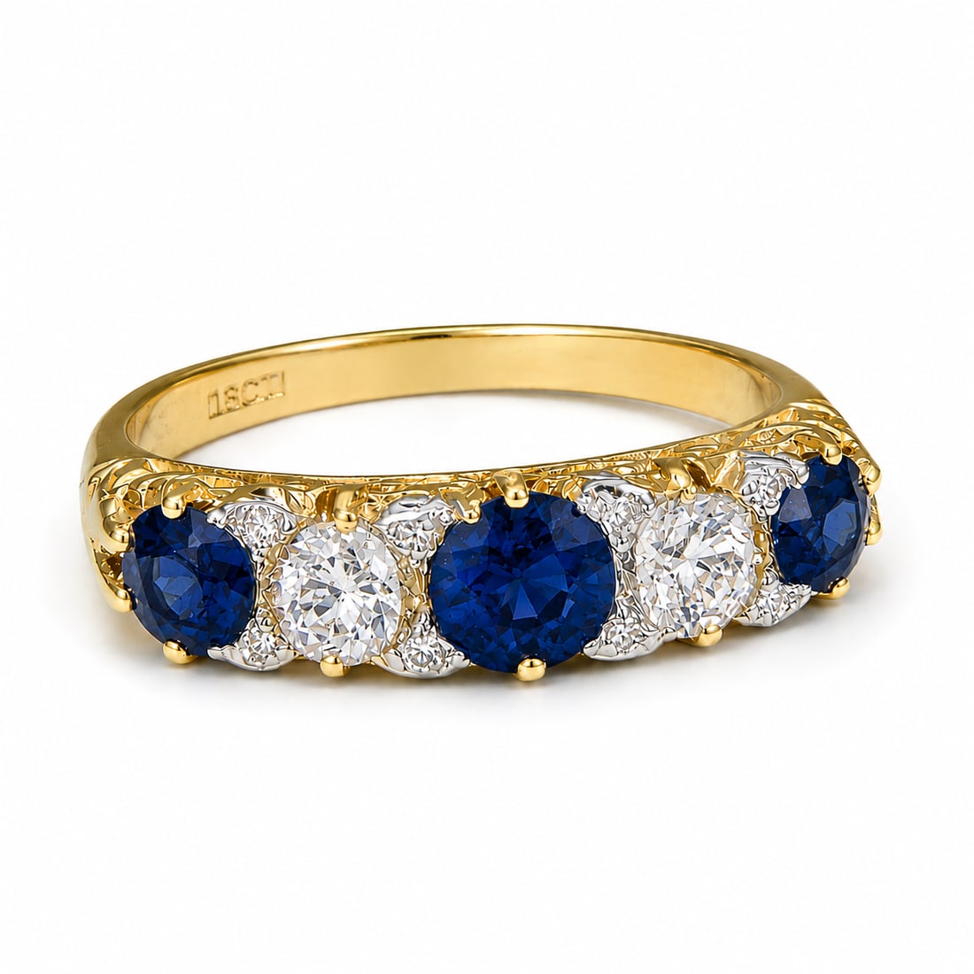 SAPPHIRE AND DIAMOND 5-STONE RING: SAPPHIRE AND DIAMOND 5-STONE RING,3.8 grams, 18 ct. gold.Rich and vibrant sapphires.Diamonds bright and lively.Size P.