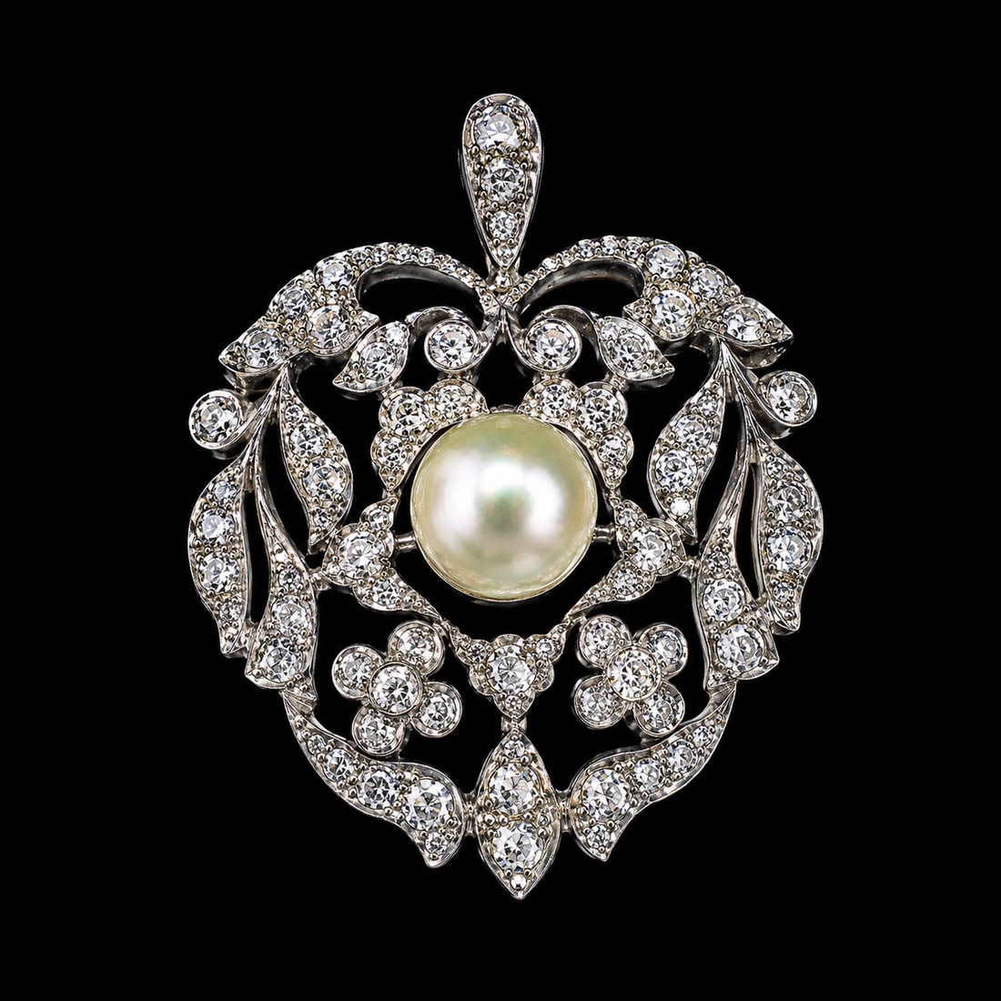 ANTIQUE CERTIFICATED NATURAL SALTWATER PEARL AND DIAMOND HEART PENDANT: ANTIQUE CERTIFICATED NATURAL SALTWATER PEARL AND DIAMOND HEART PENDANT,7.6 grams.Diamonds bright and lively.Pearl of approx. 8.5 x 7.7 x 5 mm. (certificated, Natural Saltwater).L. 3.6 cm.